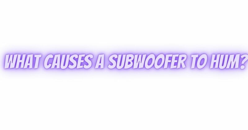 What causes a subwoofer to hum?