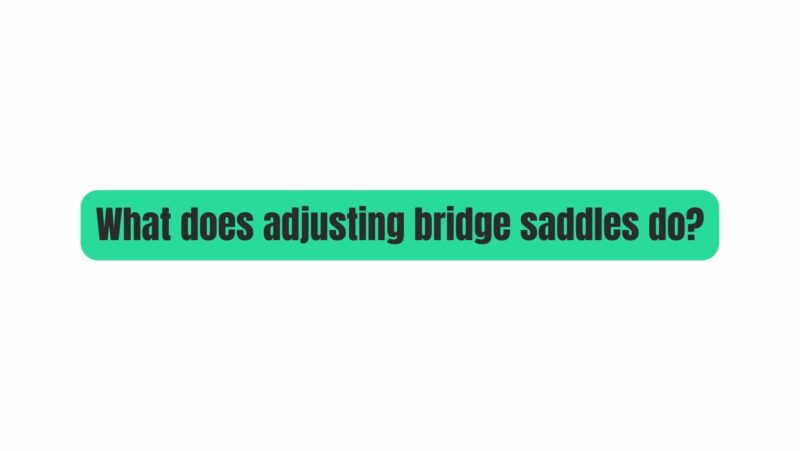 What does adjusting bridge saddles do?
